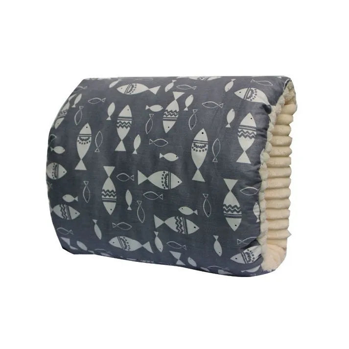 Soft baby pillow with grey fish print cover, cozy and essential for nursery comfort