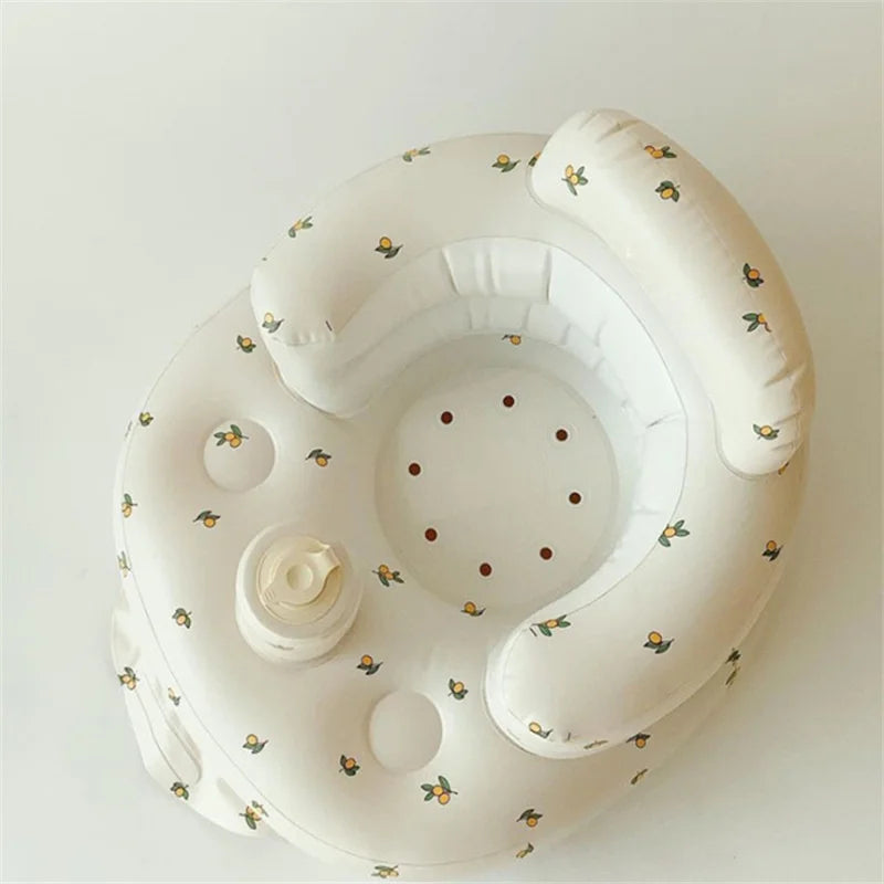 Inflatable baby seat with cushion backrest and cute floral pattern, ideal for baby comfort