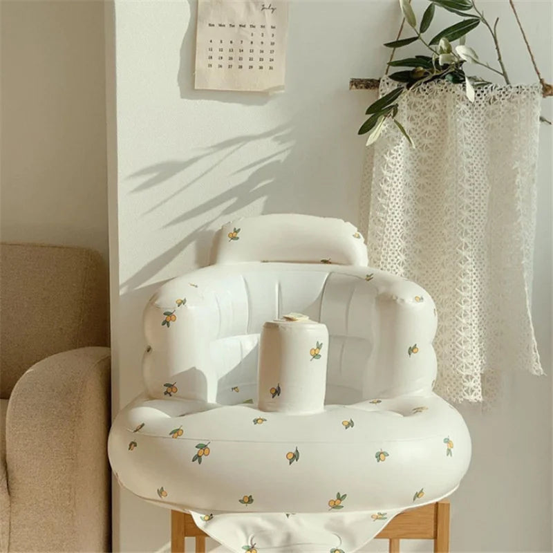 Inflatable floral baby seat in sunlit nursery, ideal for baby comfort and support