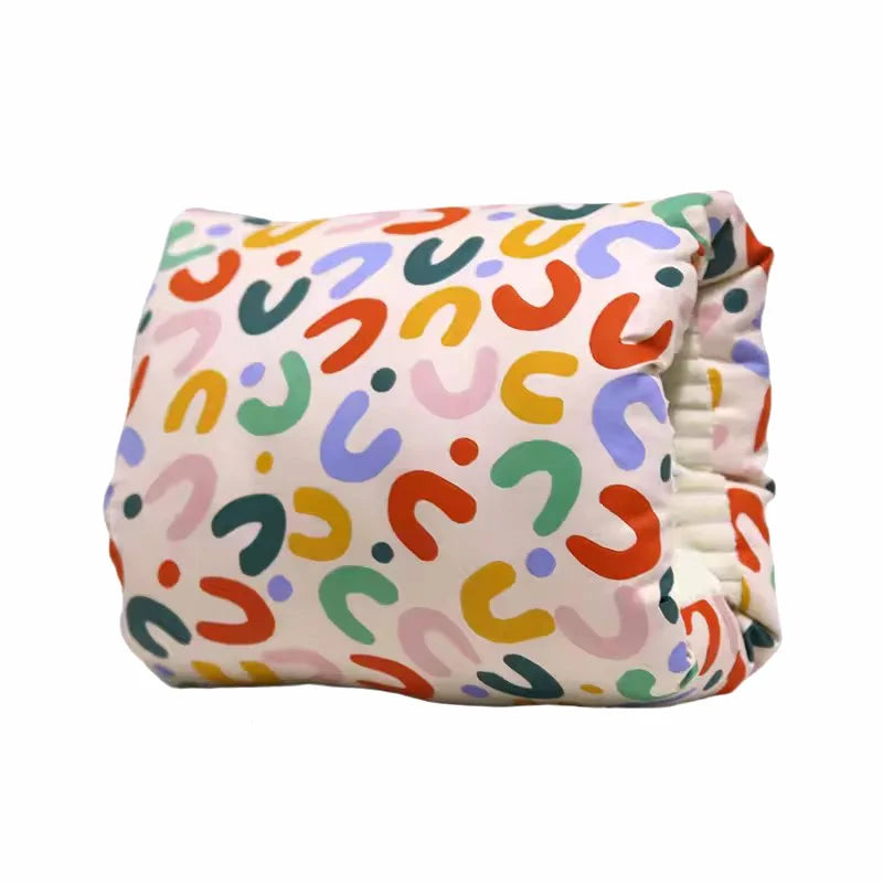 Colorful patterned baby cloth diaper on white background, Kid Zone baby essentials.