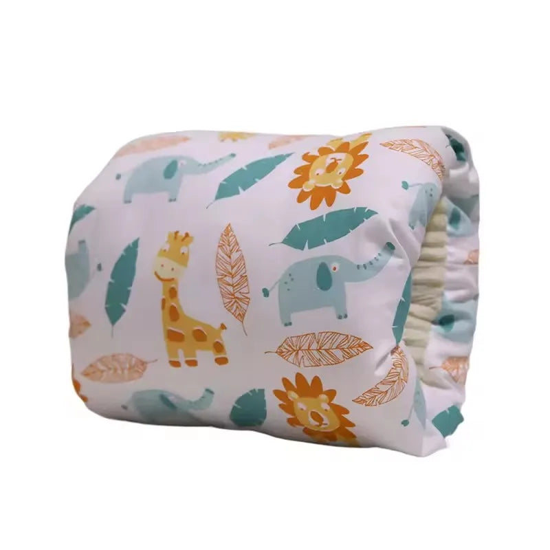 Baby diaper with colorful animal print, including giraffes, lions, and elephants