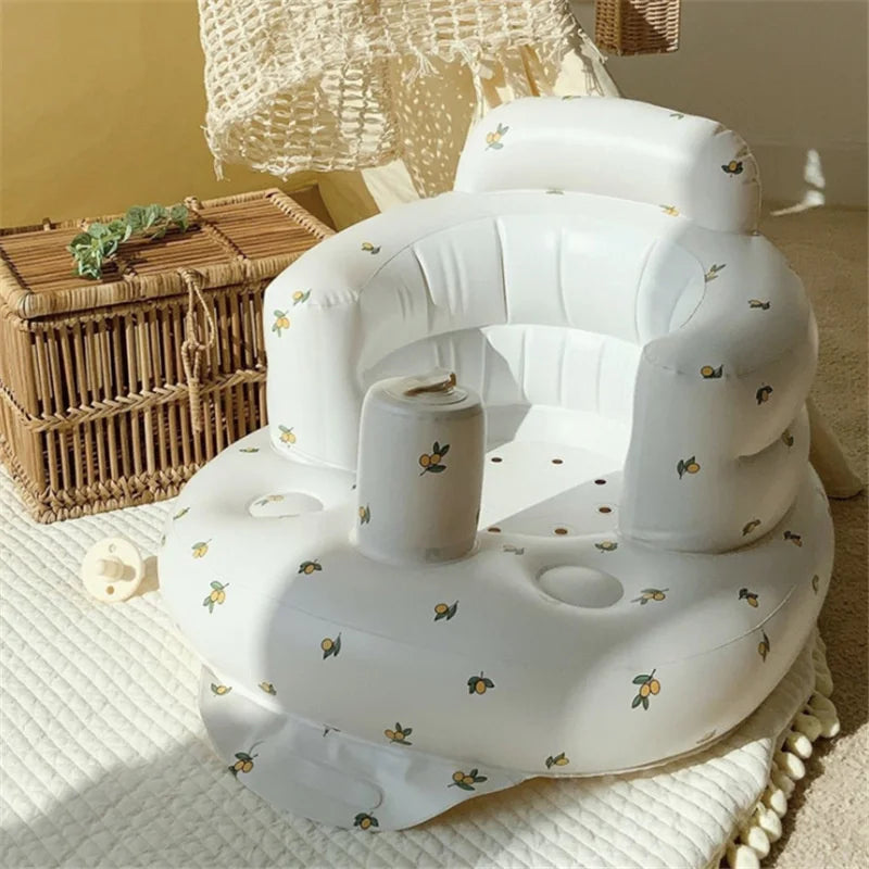 Inflatable baby seat with cute lemon print, ideal for safe play, on a cozy nursery rug