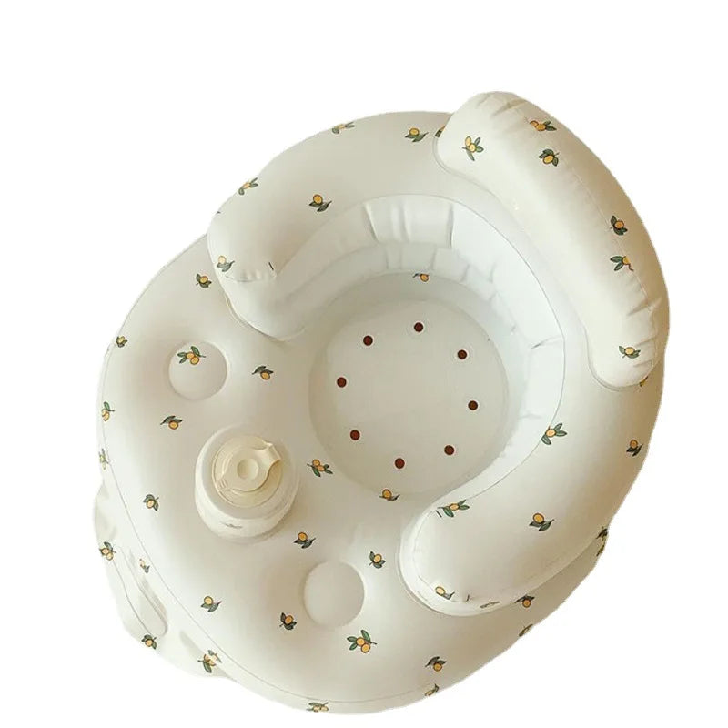 Inflatable baby seat with yellow floral pattern, ideal for infant support and comfort.